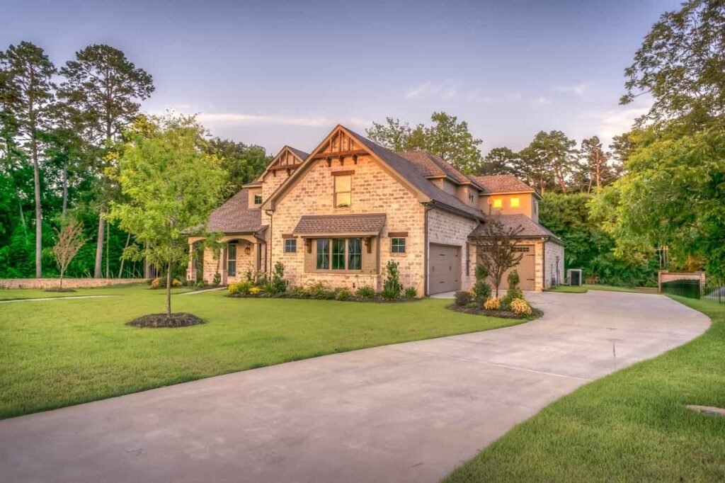 A beautiful two-story house with a large lawn and driveway