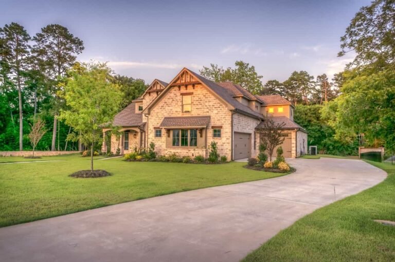 A beautiful two-story house with a large lawn and driveway