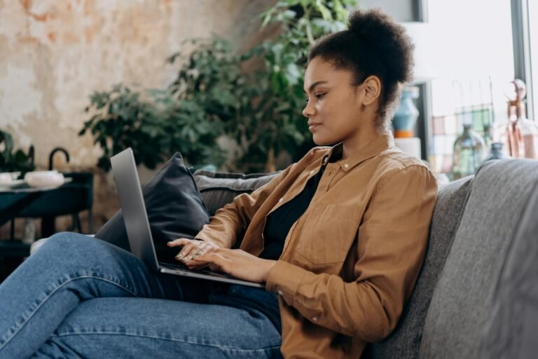 A woman working remotely from home in France, showing the relaxed and balanced work life in France